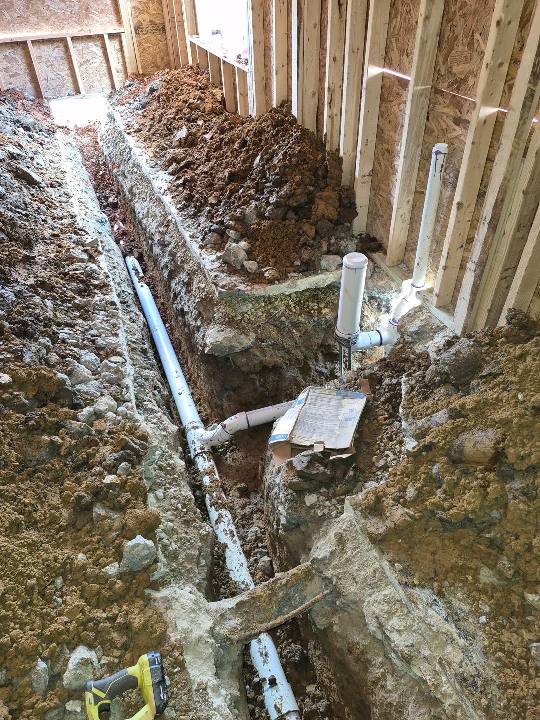 Interior drainage trench along foundation wall
